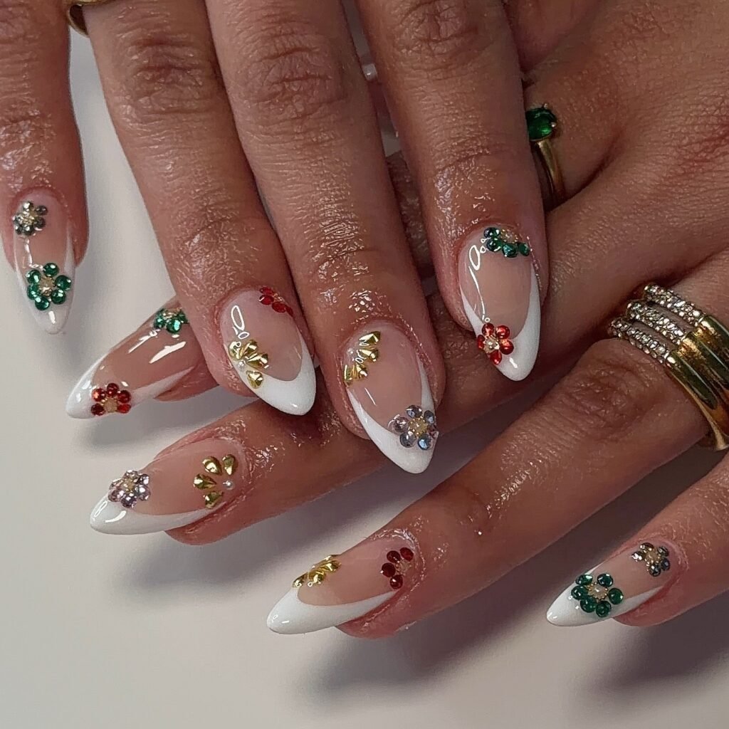 White French tip nails with colorful holiday floral gems and shimmer.  