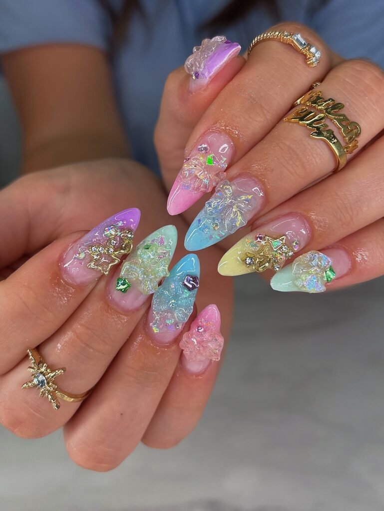 Colorful holographic French tip nails with butterfly charms and rainbow accents on fingers  