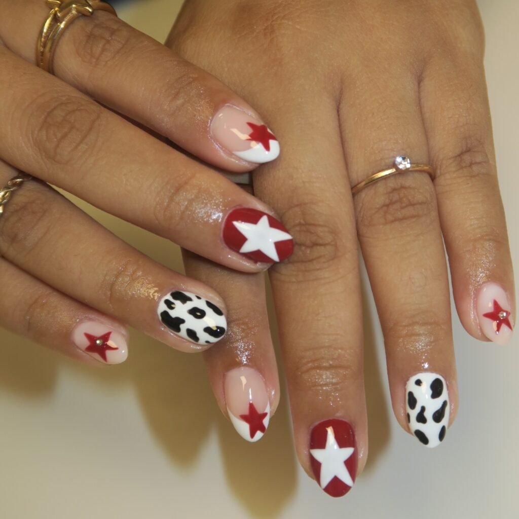 red star y2k nails with cow print accents