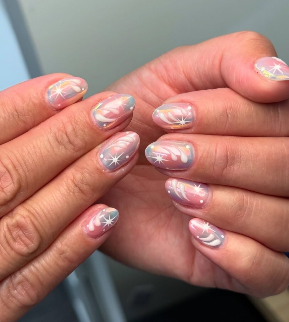airbrushed pastel y2k nails with white starburst designs
