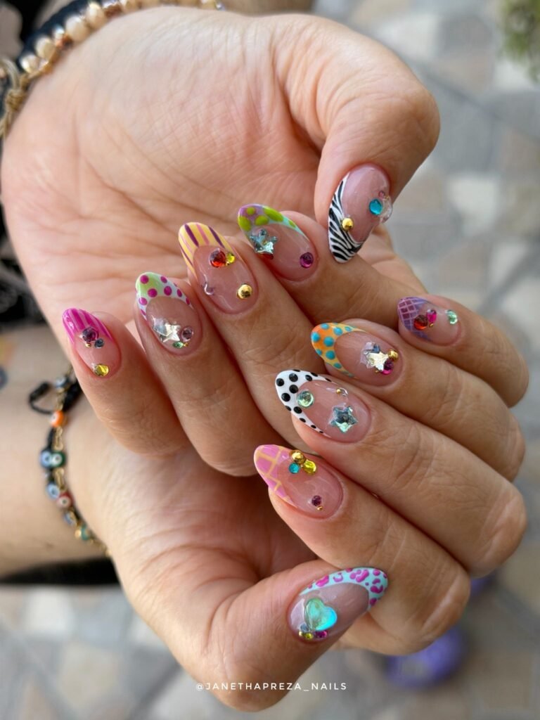 colorful y2k nails with rhinestones stars and patterned tips