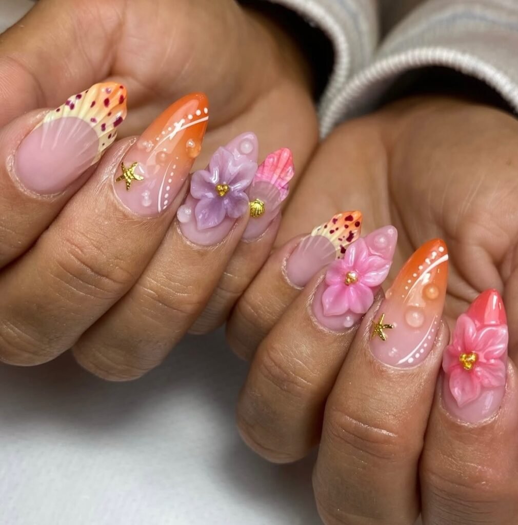 Long nails featuring neon orange, pink ombré, 3D flowers, leopard tips, and glossy statement details.