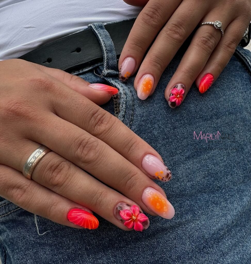 Short-to-medium nails with pink and orange floral accents, leopard print details, and glossy tropical-inspired nail art.