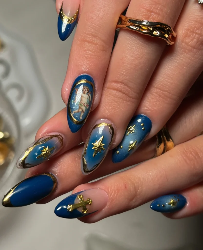 Blue almond nails with gold stars, celestial art, and nude bases.  