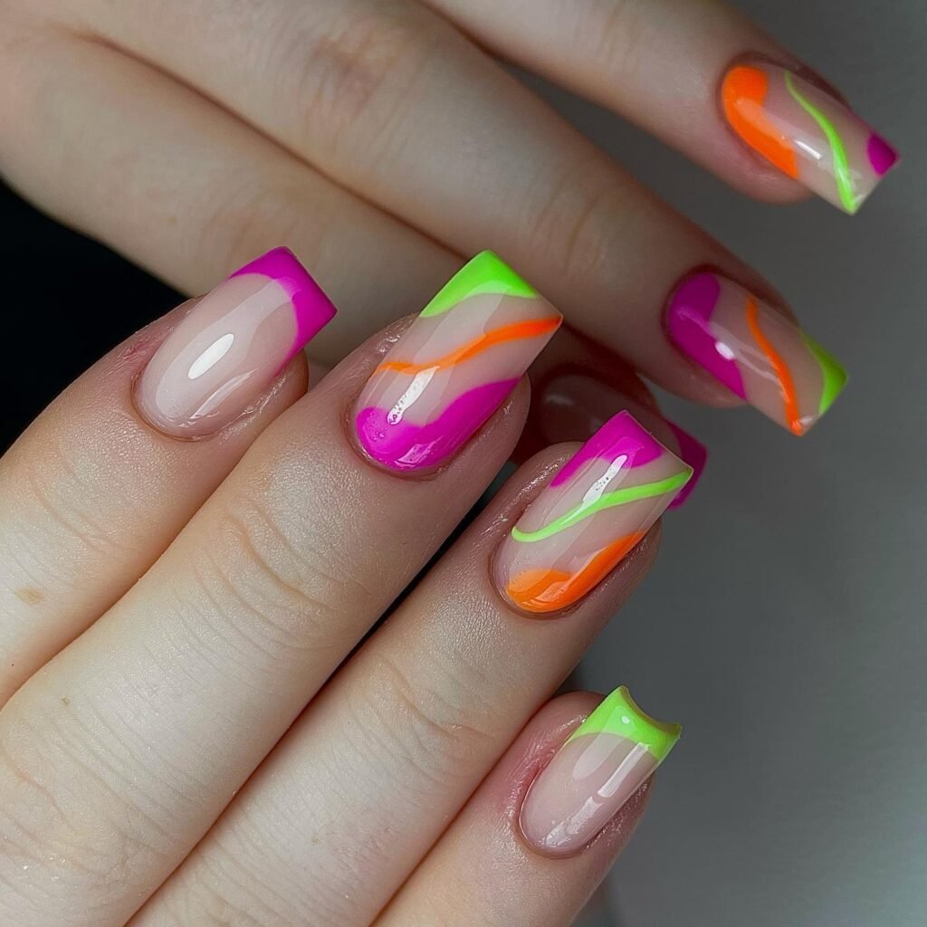 Neon negative space rainbow nails with bold angled tips