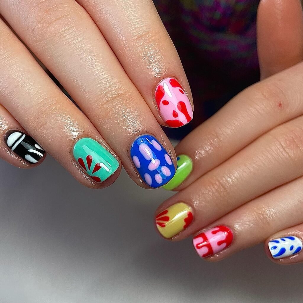 Mismatched colorful nail art with abstract rainbow pattern ideas