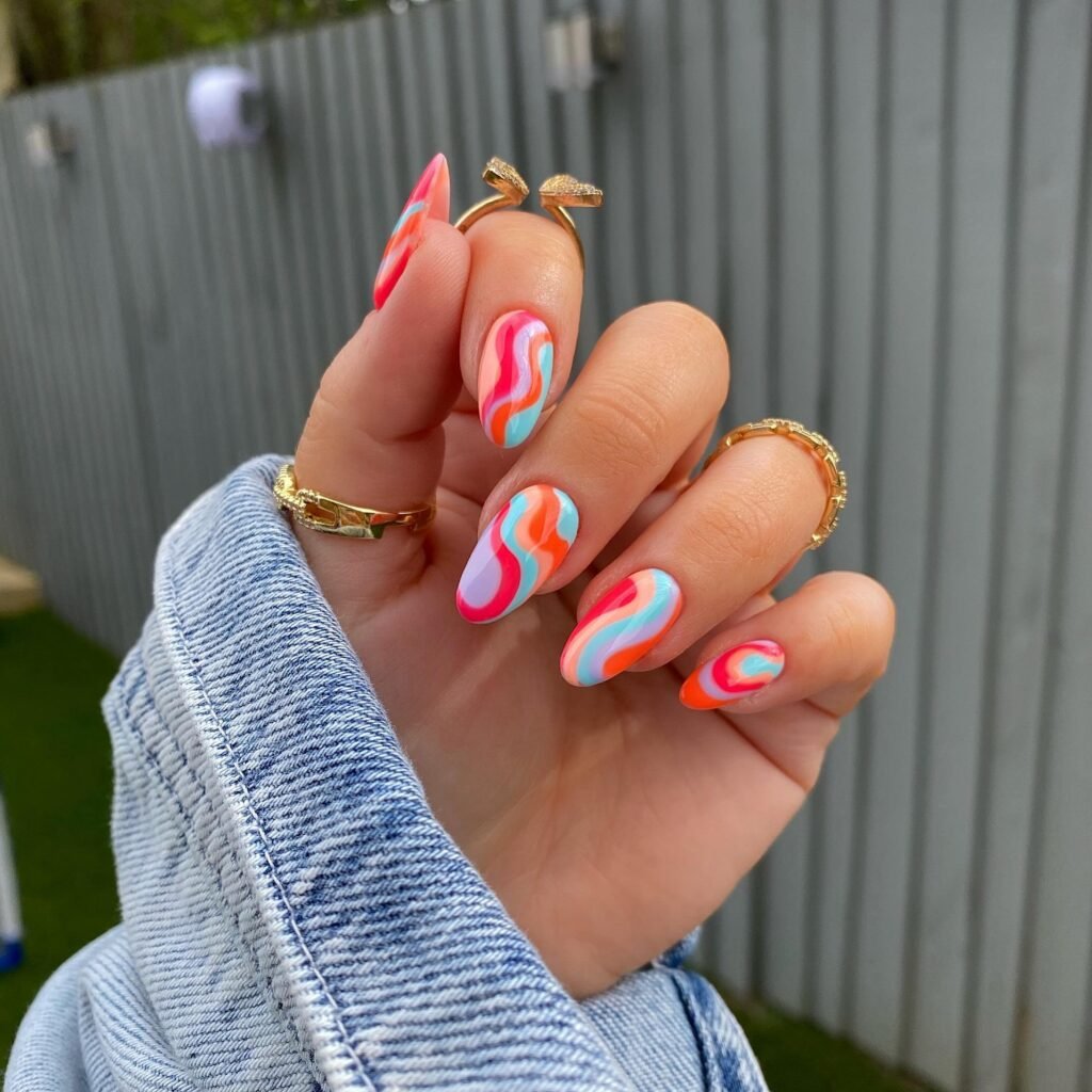  Bright rainbow swirl almond nails with pink and blue waves