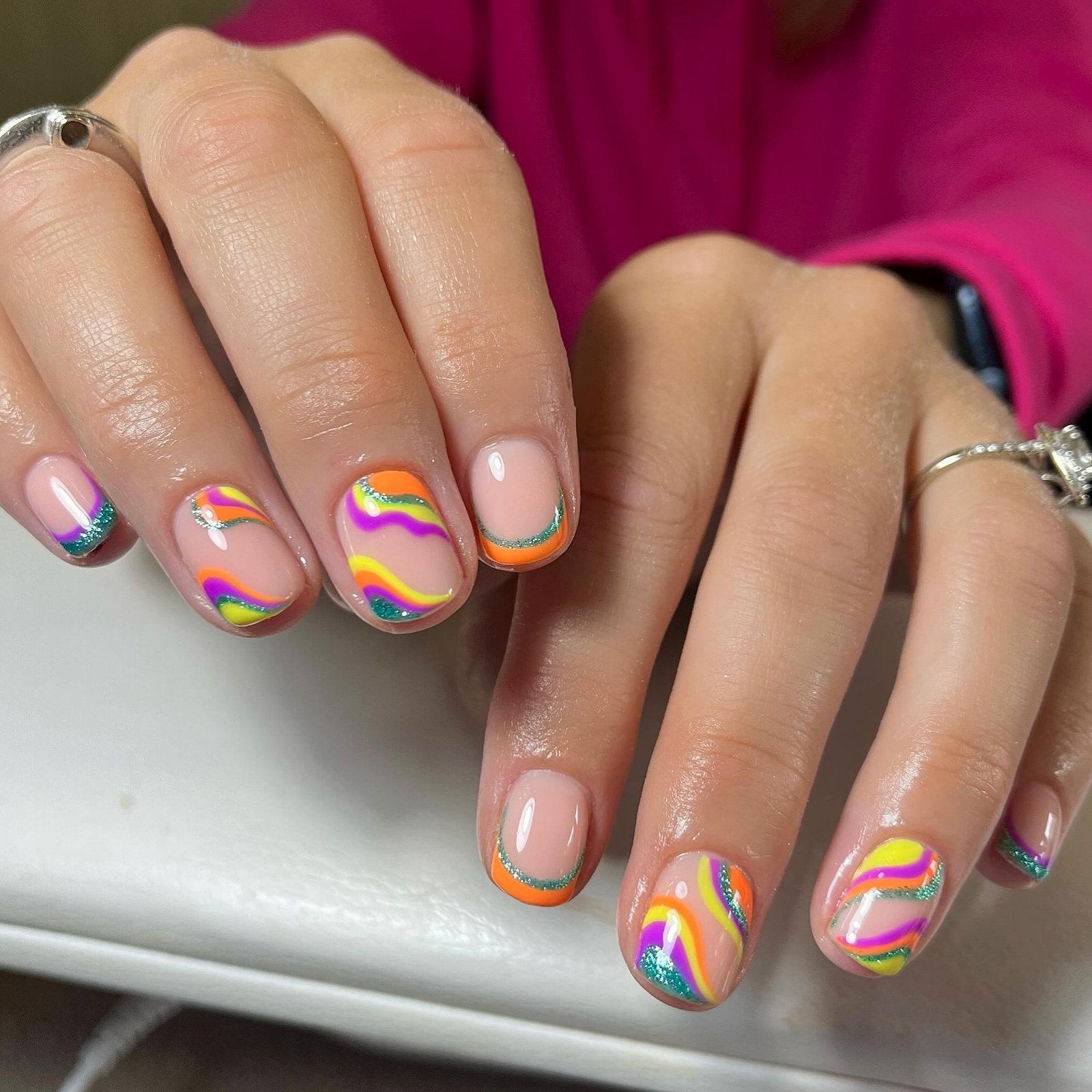 Retro rainbow wave nails with glitter French tip details