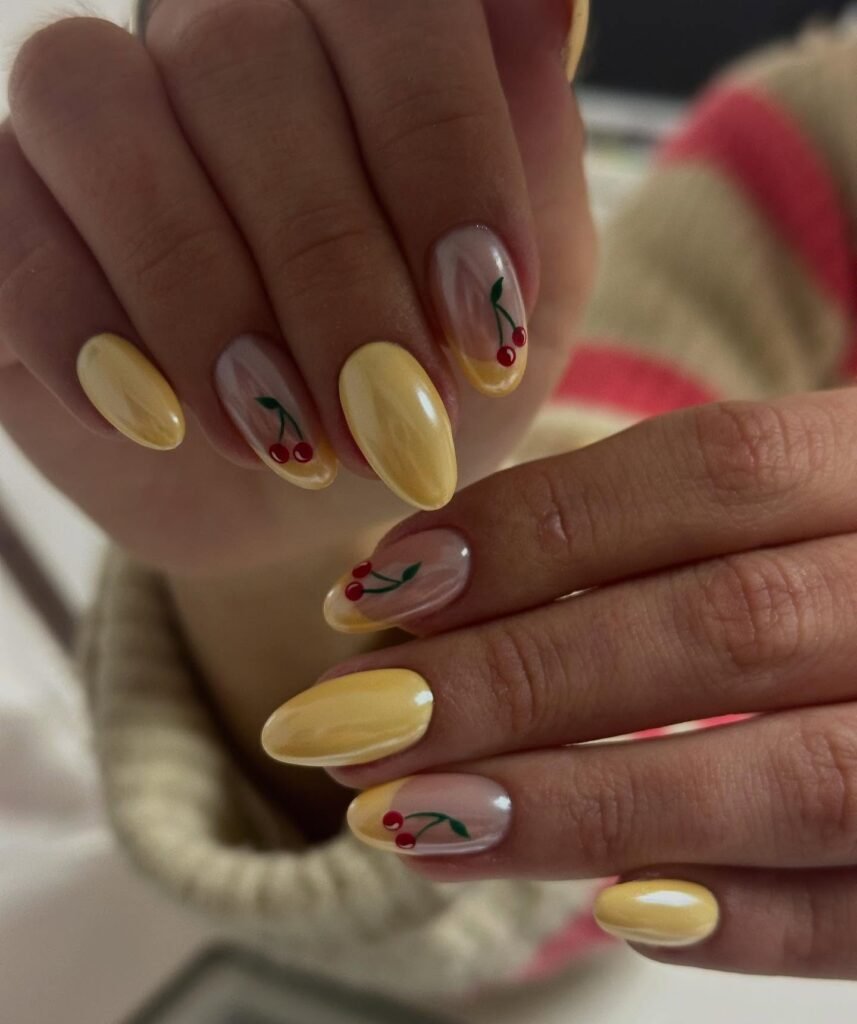 butter yellow cherry nails with soft almond shape