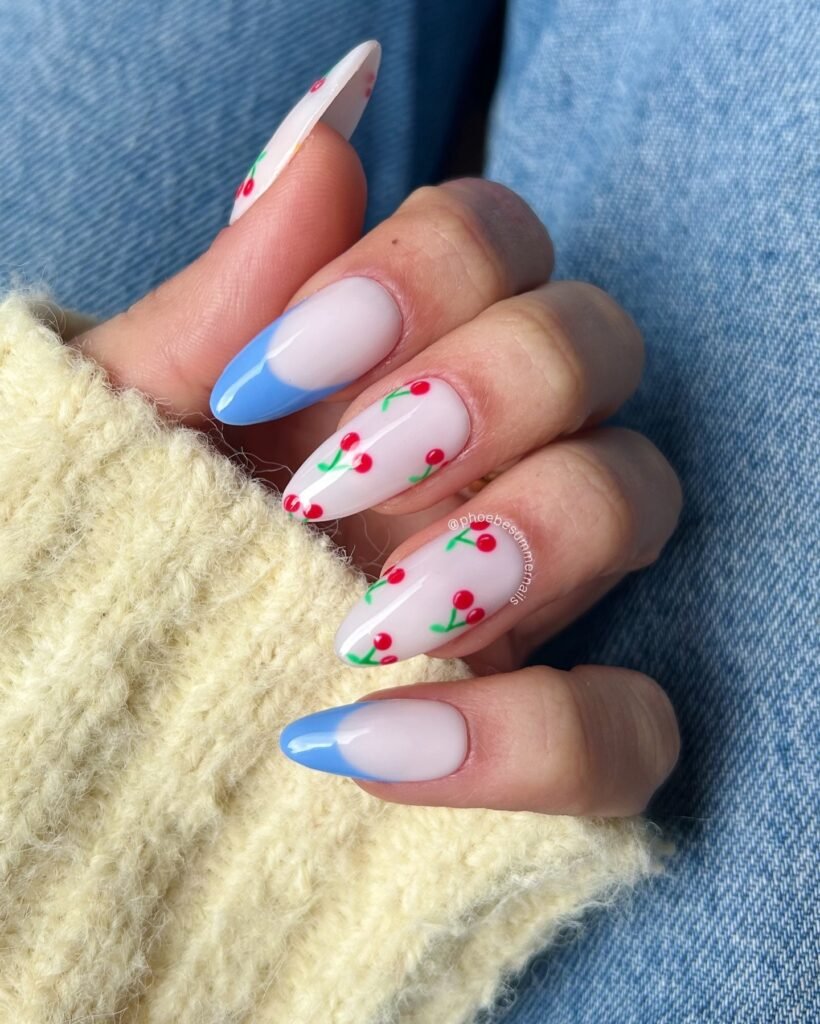 baby blue French tip cherry nails with red fruit art