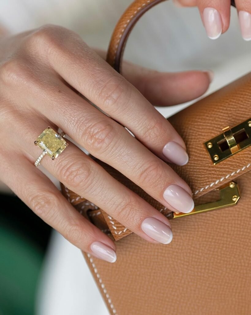 glossy invisible French almond nails with sheer pink base