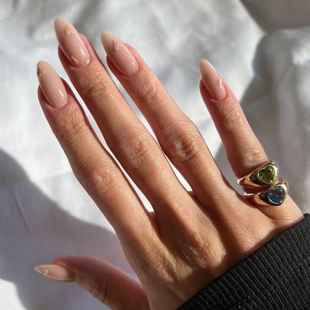 invisible French almond nails with tiny heart accents