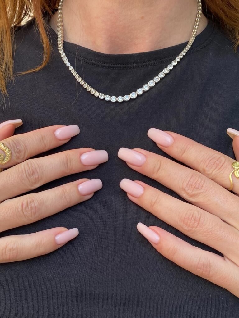 soft coffin invisible French nails with milky pink polish