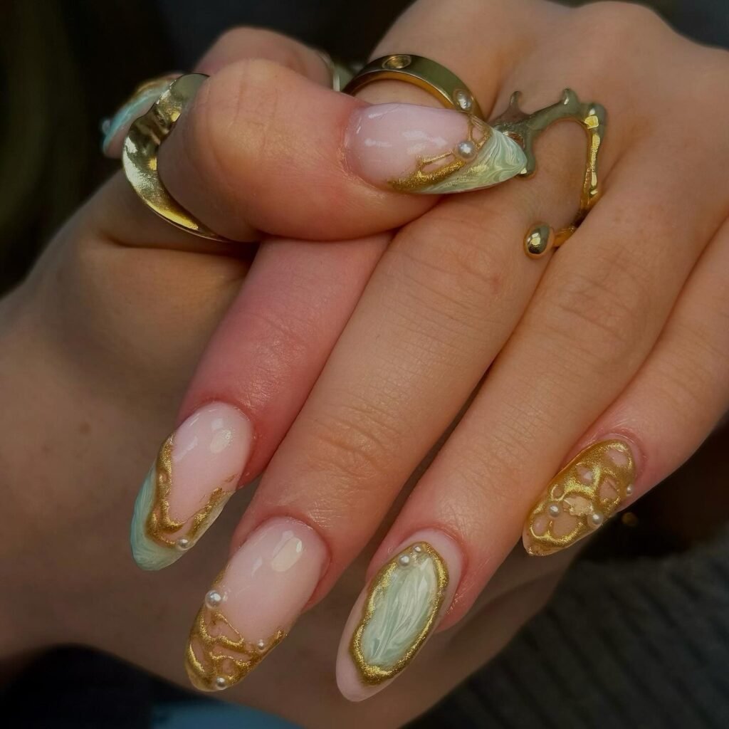 pistachio marble nails with gold and pearl details
