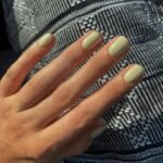 short pistachio green nails with glossy finish