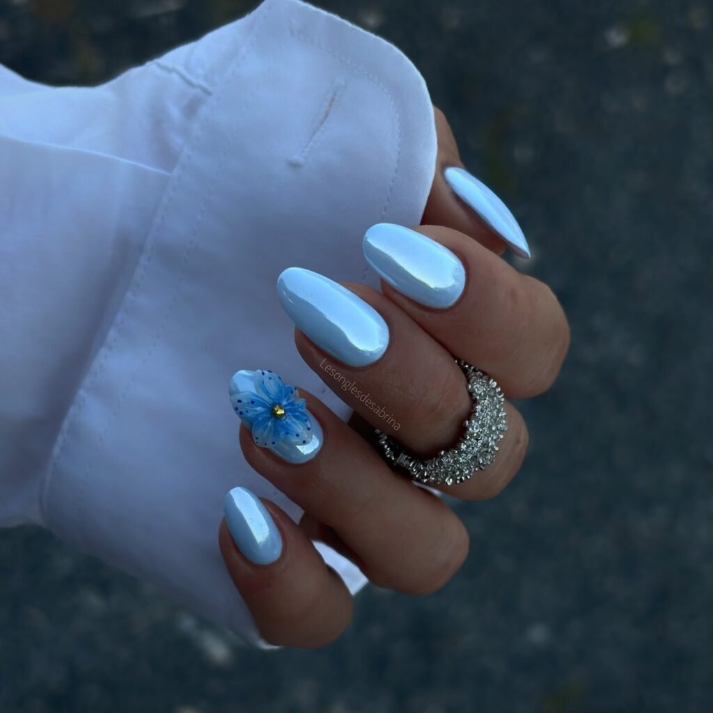 blue chrome June nails with flower accent
