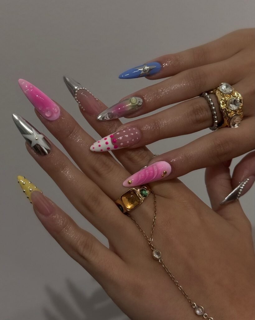 y2k maximalist nails with chrome stars and 3D details