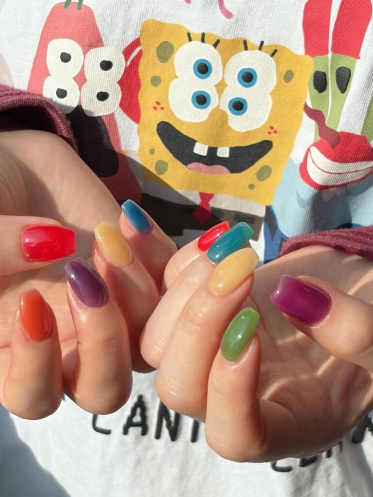 glossy jelly skittle nails in bold summer colors