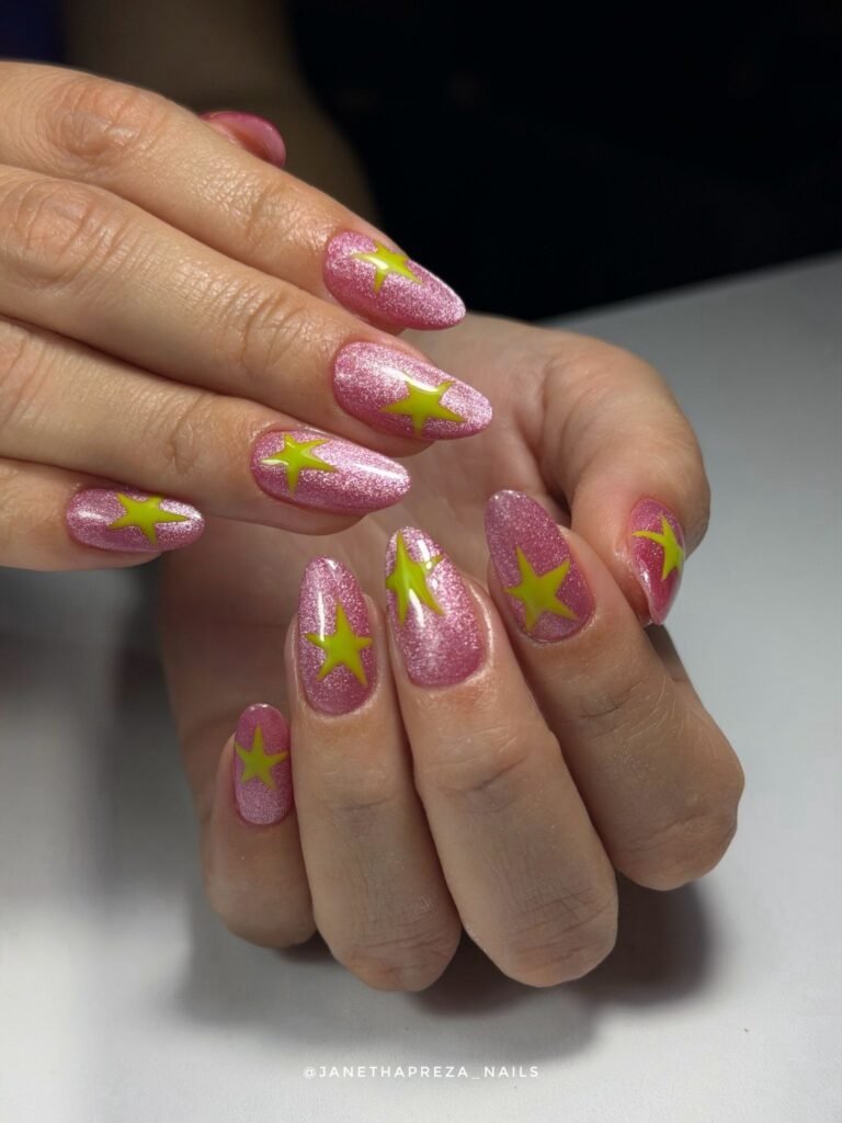 pink glitter nails with neon yellow star designs