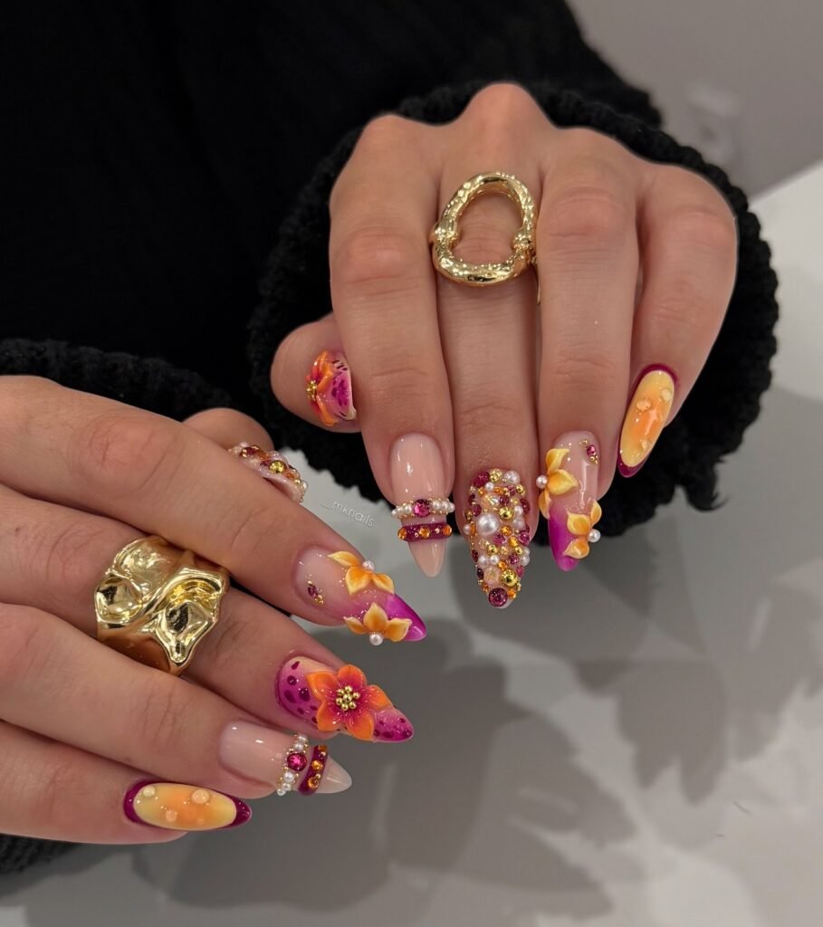 Luxury sunset nails with rhinestones pearls and flowers