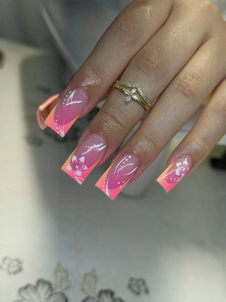 Square pink orange French nails with white flowers