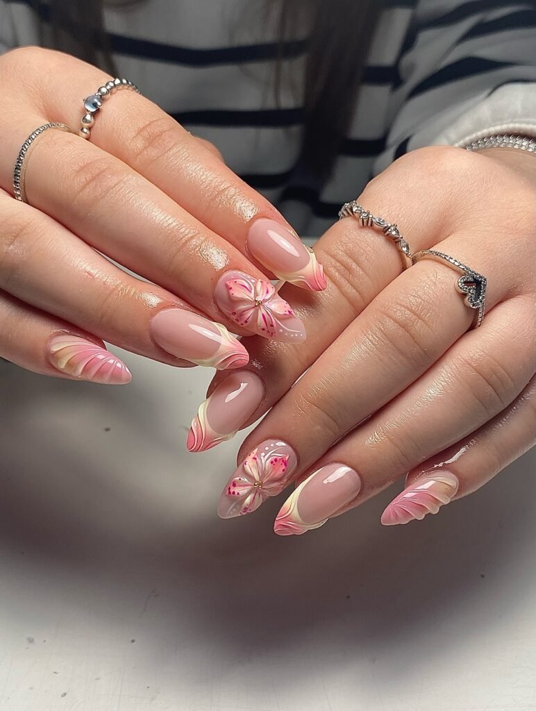 Soft shell sunset nails with pink floral accents