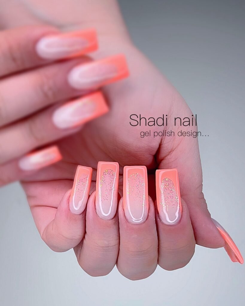 Peachy coral glitter French nails with glossy square tips