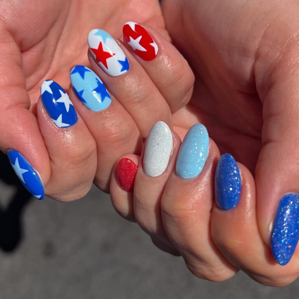 red white and blue star nails with glitter accents