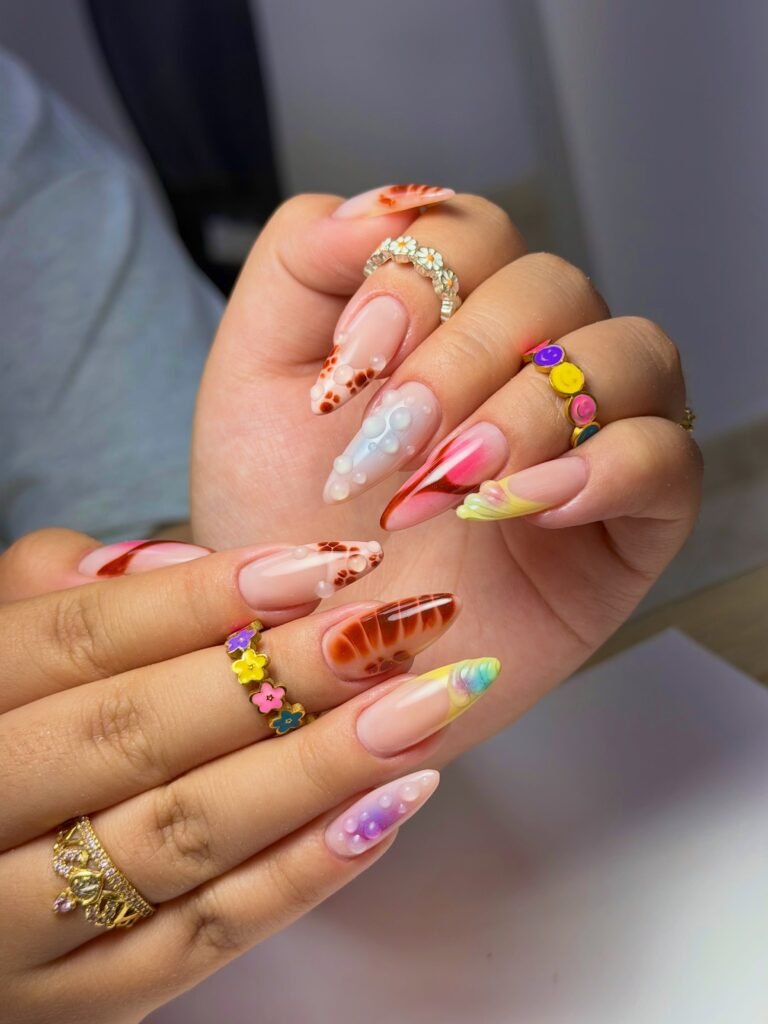 maximalist colorful nail design with 3D summer accents