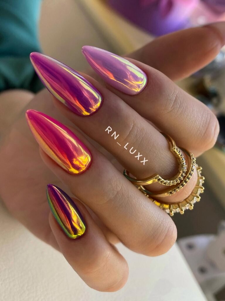 Iridescent rainbow chrome stiletto nails in pink purple gold