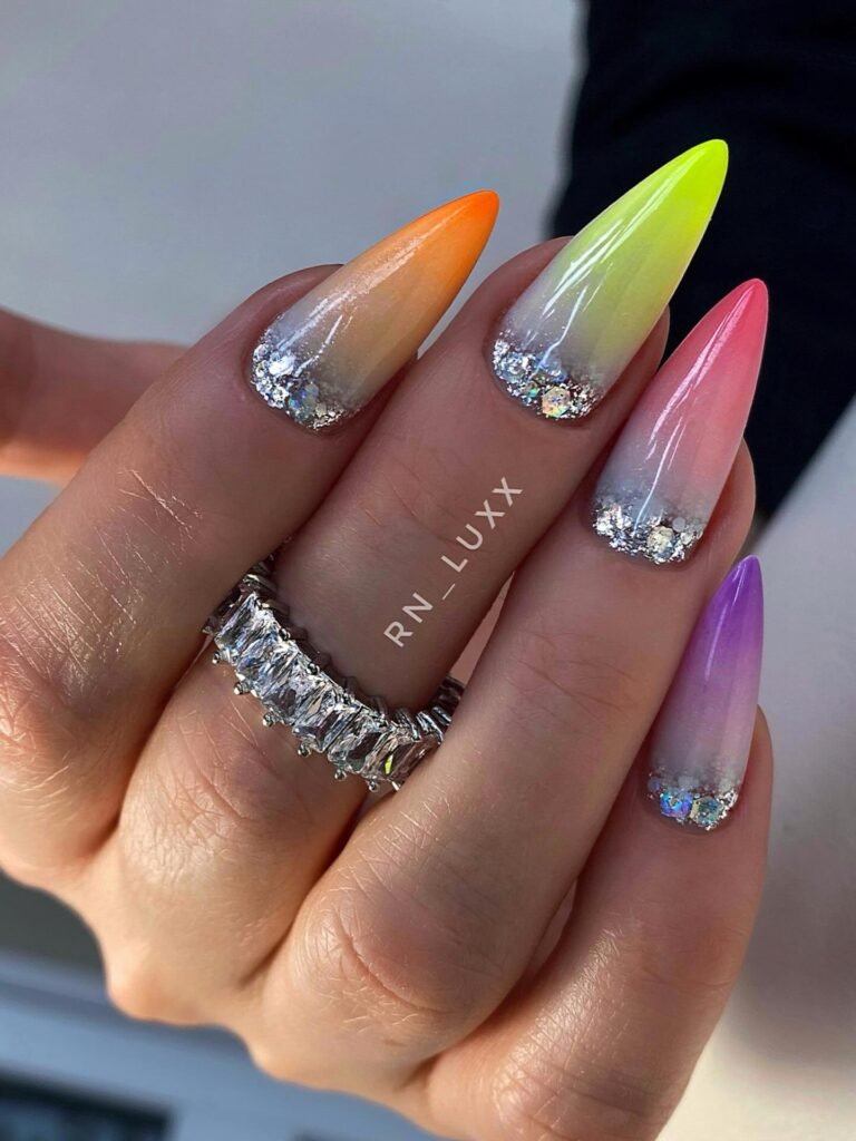 Pastel rainbow ombre stiletto nails with silver glitter cuticles